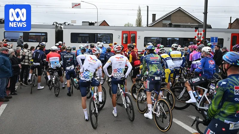 Cycling great avoids disqualification over train crossing to win Tour of Flanders