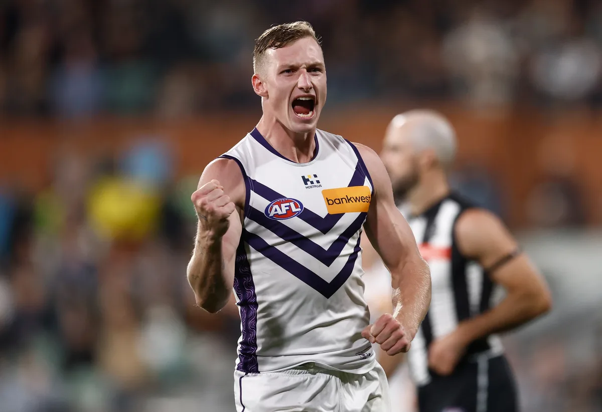 Dockers surge late to sink Pies in damp and dour scrap