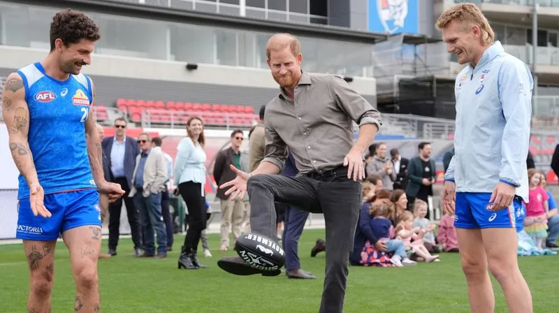 Prince Harry shows off footy skills as he tackles mental health with Movember at Western Bulldogs