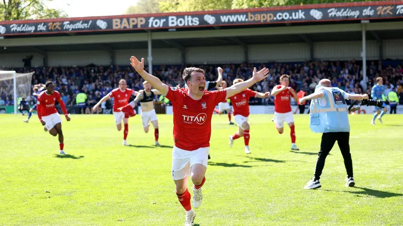‘The maddest ever’: Utter chaos as pitch invasion allows 103rd-minute promotion sealer