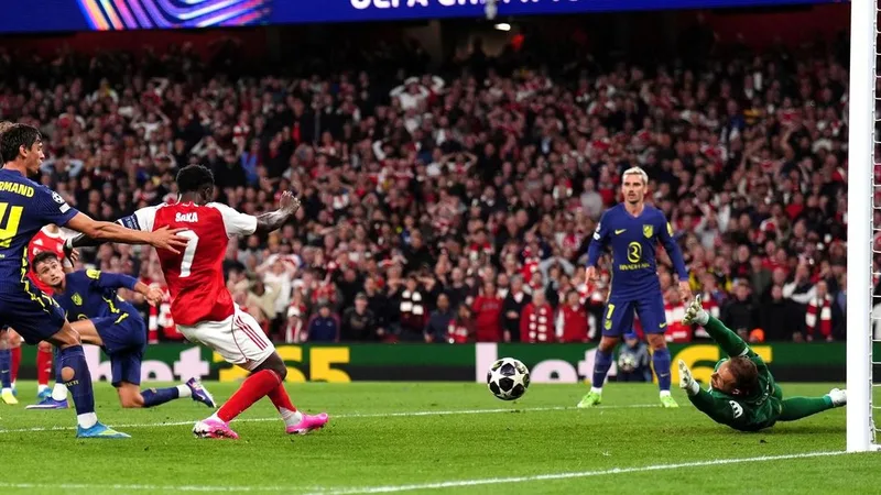 Saka seals Gunners' place in Champions League decider